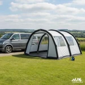 An inflatable air drive away awning pitched next to a short wheelbase VW T6.