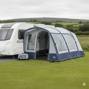 A 12V electric pump automatically inflating an air awning on a gravel pitch at a British holiday park.