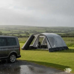 A VW T6 campervan with a fully waterproof drive away awning during a rainy UK day.