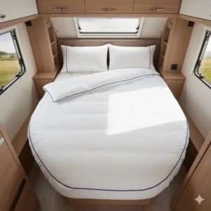 Top-down view of a short length island bed made up with a bespoke caravan duvet.