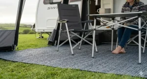 A family walking barefoot on a soft, woven breathable carpet inside a spacious awning on a summer afternoon.