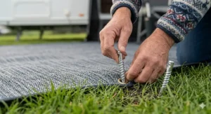 A "campsite friendly" logo on an awning carpet bag, indicating it meets UK site regulations for grass protection.