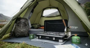 A compact, lightweight gas camping stove folded inside a hiking rucksack for a trekking trip.