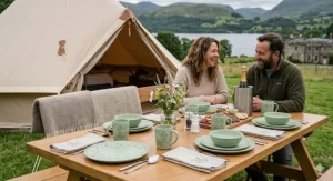 Stylish patterned melamine camping dinnerware set laid out for a luxury glamping experience in the UK countryside.