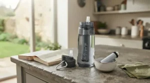 A comparison showing a standard stainless steel flask next to an advanced filter water bottle designed for safe drinking water worldwide.