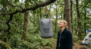 Comparison of a budget bear bag kit under £30 alongside premium bear-resistant canisters.