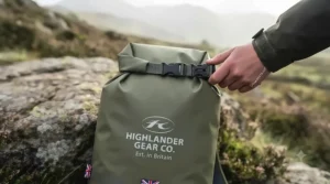Securing the roll-top closure on a waterproof food sack for backpacking.