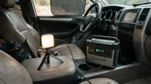 A rechargeable LED camping lantern connected to a power bank inside a campervan before heading off-grid.